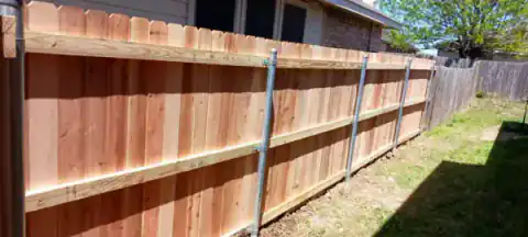 Raw western cedar fence project in North Texas