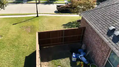 Aerial view of cedar fencing and a backyard patio.