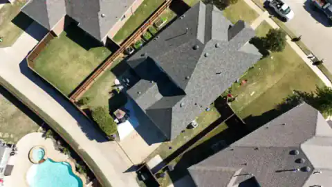 Aerial view of cedar fencing around a North Texas neighborhood home.