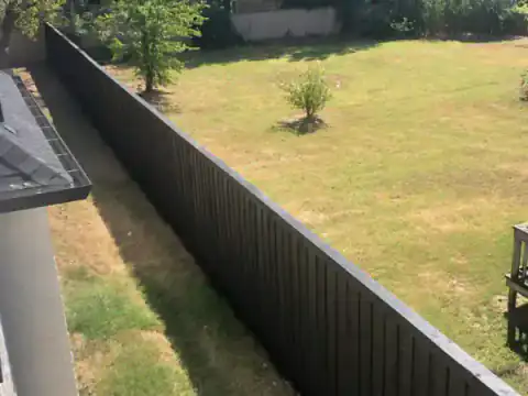 Aerial view of cedar fencing along a residential boundary.