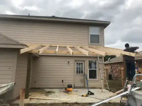 New concrete patio takes shape beside a North Texas home.