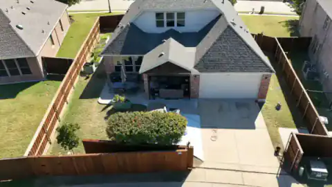 Aerial view shows cedar fencing around a North Texas property.